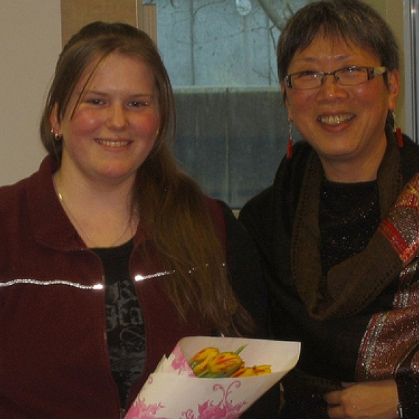2009 Anthropology Awards Reception Katie, left, is one of two recipients of this year's Anthropology Club Award. Imogene Lim, right, presents her with flowers and her award; March 12, 2009. 