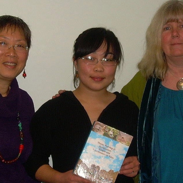Altyn Oimok Visitors Guljan Kudabaeva, anthropologist and translator from Altyn Oimok, presenting a book to VIU. Imogene Lim, left, and Helene Demers, right, of VIU. 
