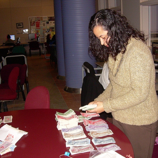So much money Lisa, one of the ANTH 316 students, counting Canadian Tire money.