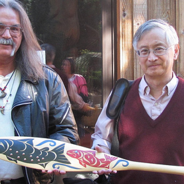Holding the Cowichan paddle Harley Wylie (l) and Hayne Wai (r), guest panelists for the screening of Cedar and Bamboo