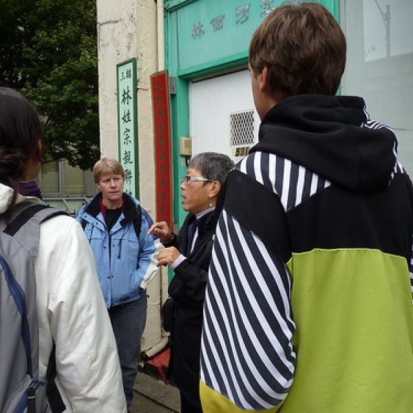 Tour Guide Imogene Lim acting as Chinatown tour guide for Dawn Thompson's ENGL class. Standing outside the Lim Society building on Carrall Street. Photo courtesy of Tricia A.