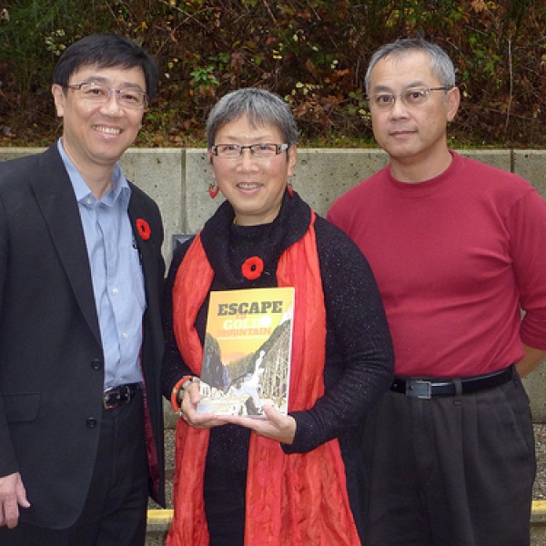 David Wong, author E2GM David (l), with Imogene holding a copy of Escape to Gold Mountain. 